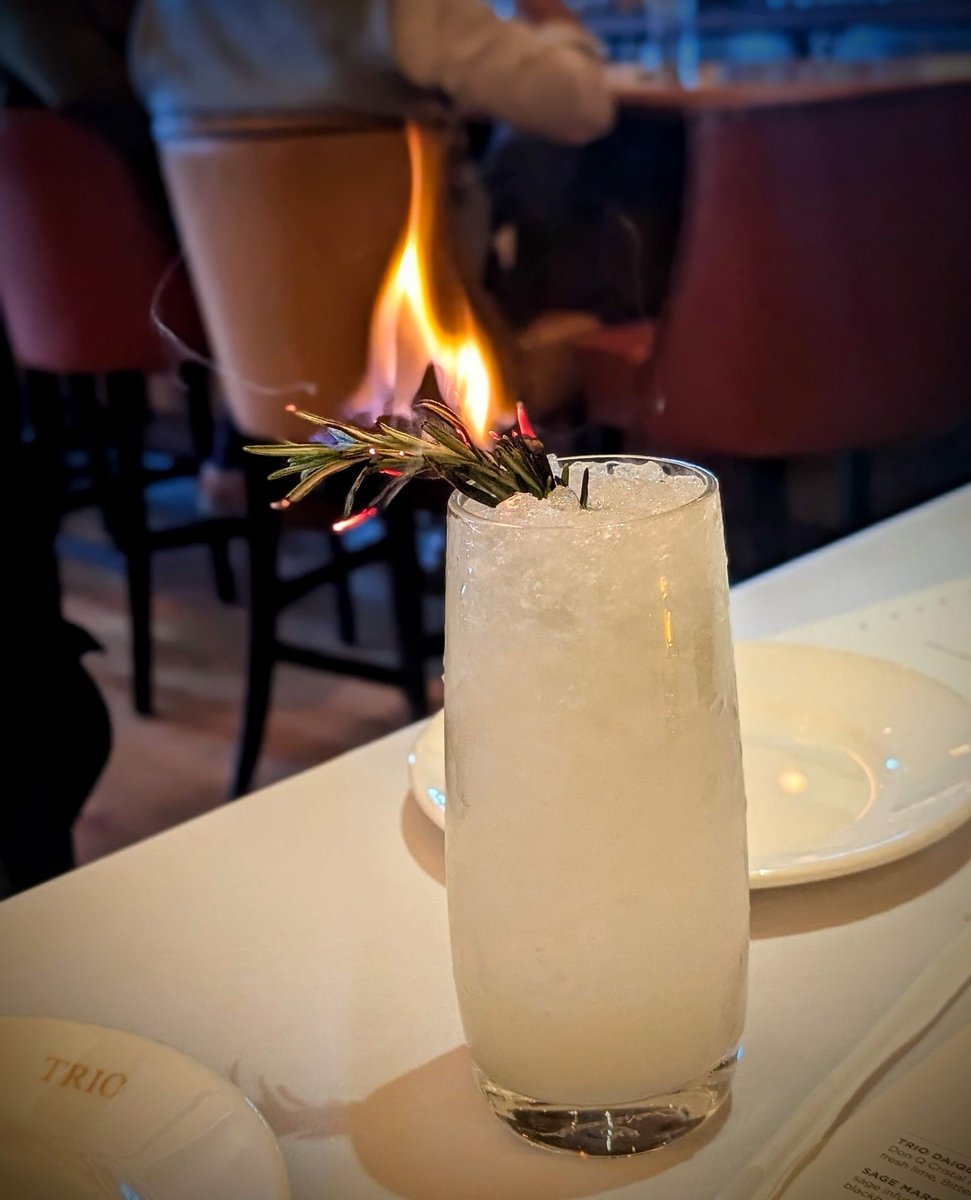 Extra! Extra! 📰 Introducing the "Daily News" cocktail at Trio Grill. A refreshing blend of Open Road Distilling Co. American gin, jasmine tea, and a touch of citrus, that's sure to make your day. Get your first edition tonight!