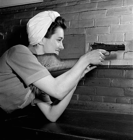 Madeline Solotwinski checks a Browning Hi-Power destined for Nationalist China. April 1944. 

Photo taken in the Small Arms Plant in Long Branch, Ontario by Ronny Jaques.
