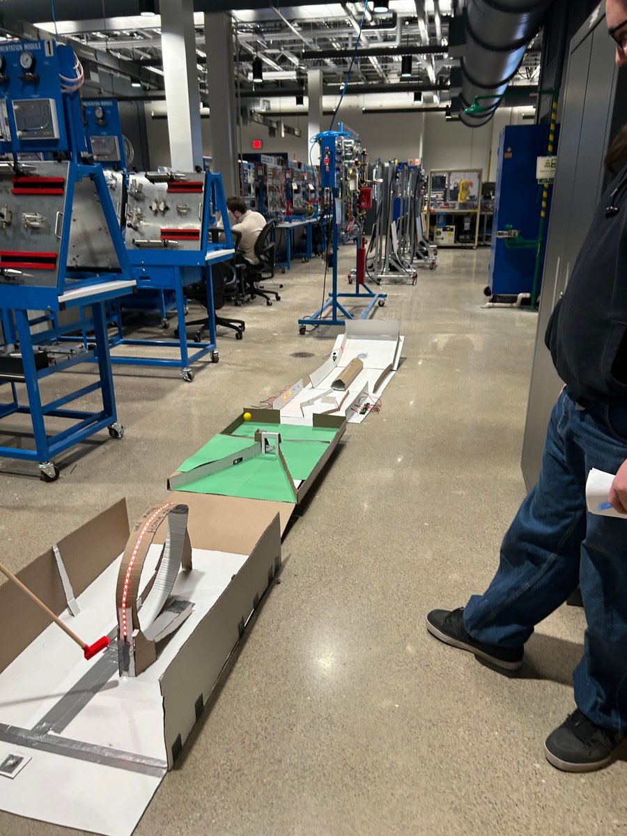LehighCTI's tweet photo. Students in LCTI's Automated Industrial Tech program created a cardboard mini golf course w/lights, motion & sound. They set up the course on Tuesday & there was a team competition for the title of "Judge's Choice" golf hole. This is how we innovate! #weinnovate #opportunityahead https://t.co/Kd0GFL7TLr
