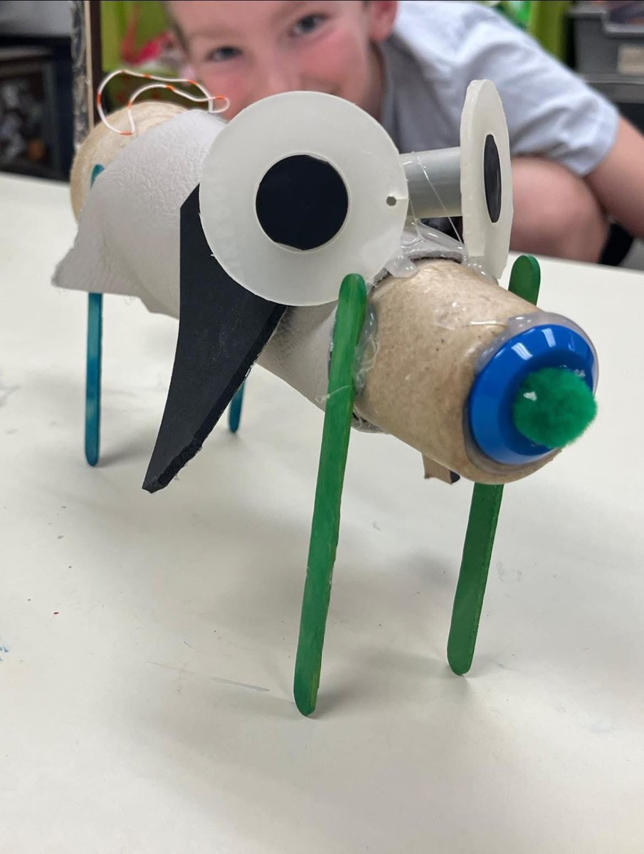 Mrs. B and the 4th grade built robot dogs in art class !