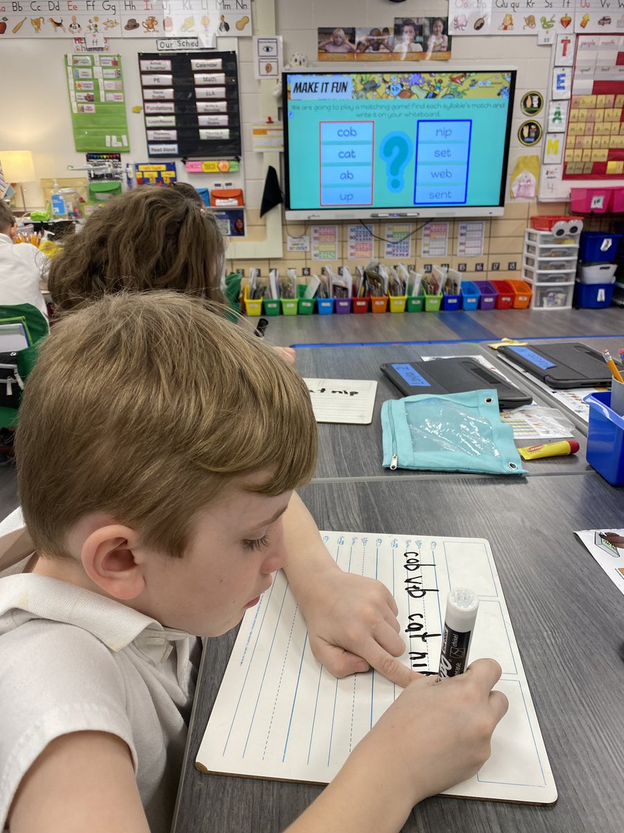 First graders are hard at work matching syllables to make words. #RoyBulls #D83Shines