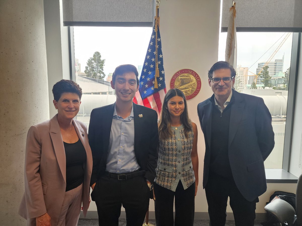 SFSU's tweet image. Thank you, State Senator Josh Becker (right), for meeting with the SFSU delegation for CSU Advocacy Day! Led by SFSU President Lynn Mahoney, the delegation was in Sacramento today to share concerns about a proposed 7.95% reduction of the CSU’s budget. #stopCSUcuts