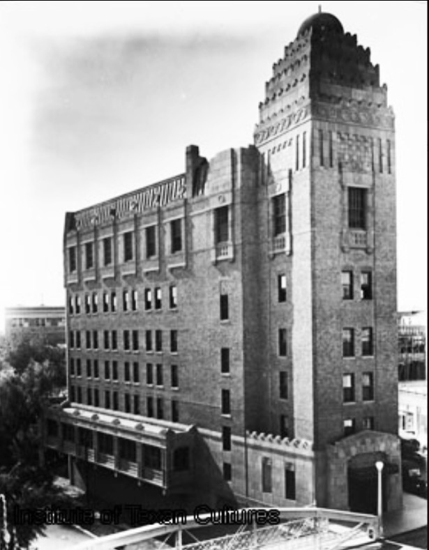 Has anyone ever seen a photo of the Casino Club building with "100 000 00" on the river side? Or do you know what these numerals mean?

Photo circa 1927; UTSA Special Collections