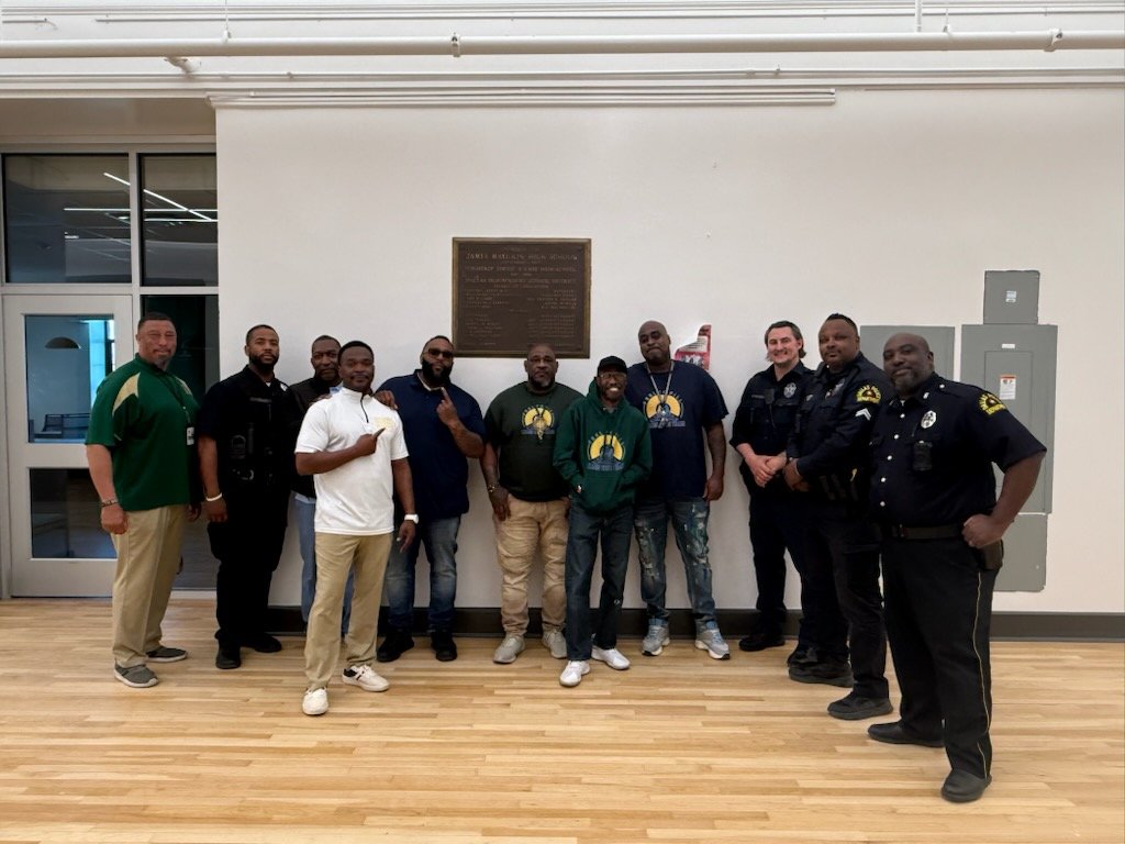 DPD and Learn with Train organization speaking to the young men at the "Great" James Madison High School.