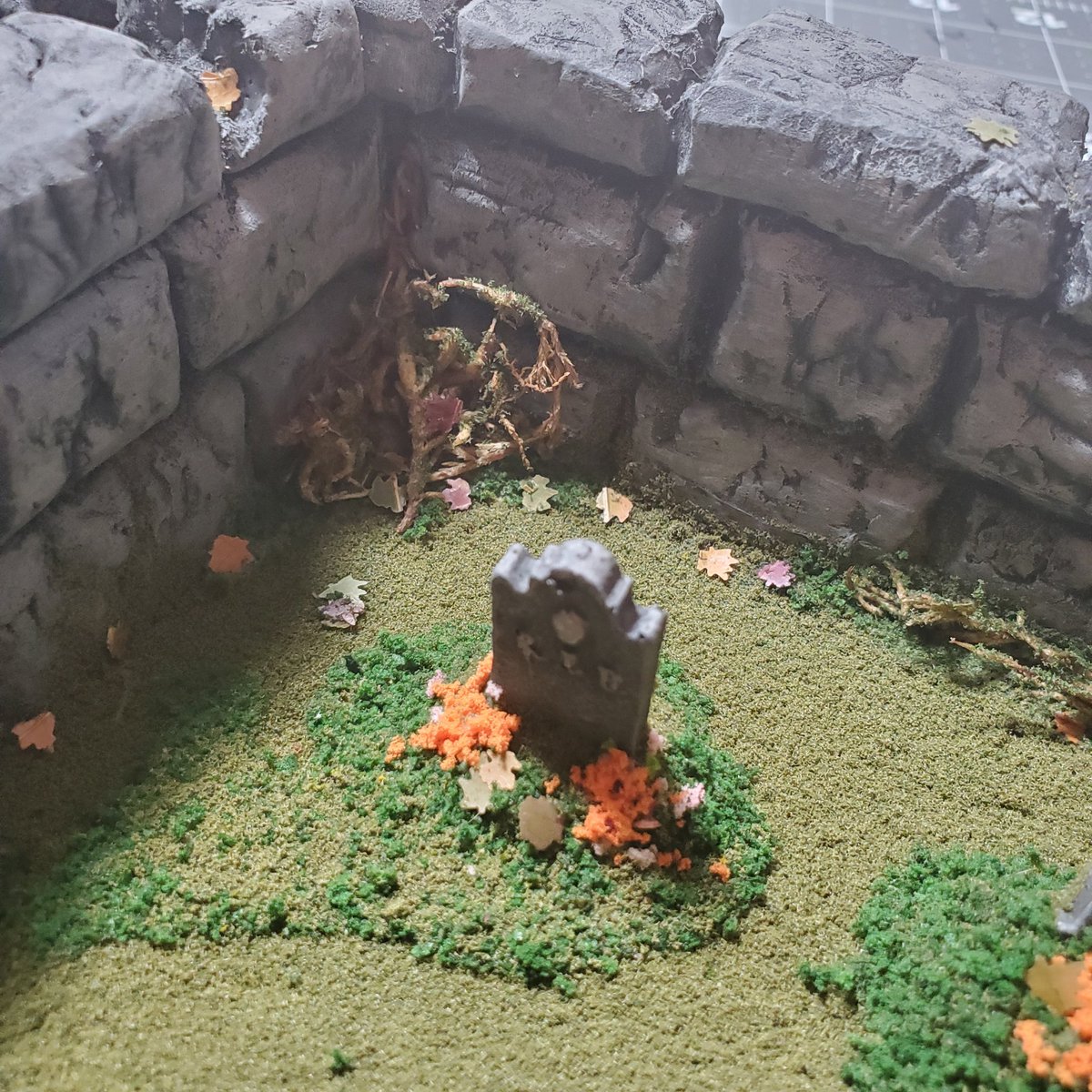 timthulhu's tweet photo. Finished up this little graveyard scene a few days ago. Would be cool as tabletop gaming terrain or maybe part of a display or a diorama. Foam board base, foam sheets for the brick walls, gravestones cast from resin from some molds I made awhile ago. Let me know what you think. https://t.co/tR7b5lZHrx
