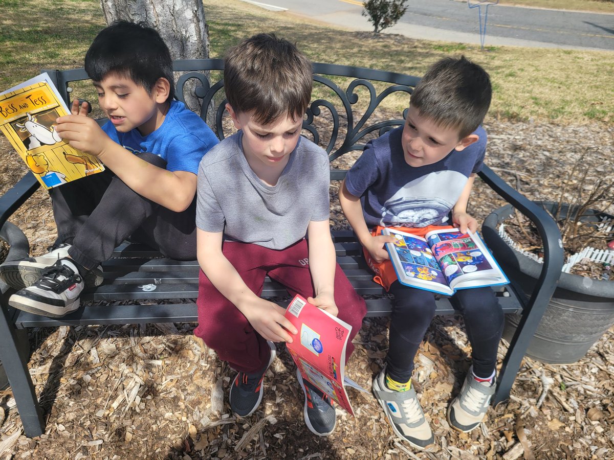 Sun, smiles, and stories! We enjoyed our independent reading time in the garden today! #mvesgainesville