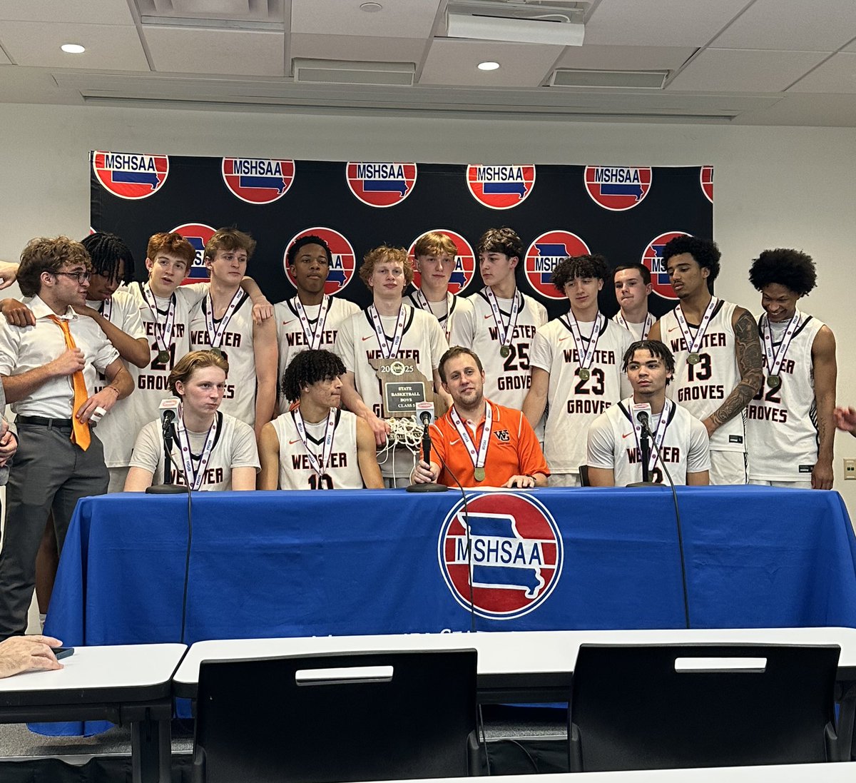 The entire Webster team in the media room after winning the Class 5 state championship