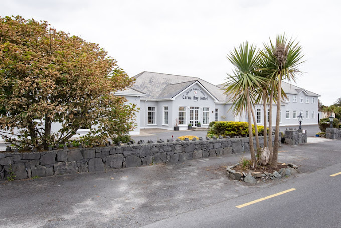keira_con's tweet photo. Ireland's tourists Industry is dying, no hotels to house tourist, yet we close up hotels in some of the most beautiful tourists areas.

Carna is a long way from any where, very little employment or entertainment and is 1 hr 19 min (79.7 km) from Galway City.

Yet Another hotel bites the dust Carna Bay Hotel is scheduled to become a IPAS center, 

It is proposed to house over 80 international asylum seekers at the Carna Bay Hotel

The hotel had been the subject of a well-attended public meeting calling for its restoration to the community for tourism.

Local Connemara Councillors have been advised that a proposal which  would involve the location of 84 asylum seekers in the village of Carna  is presently being considered.

According to the proposal the asylum seekers would be situated in what is described as "across 28 rooms" in the Carna Bay Hotel.

A large attendance at a meeting in the locality last week called for  the restoration of the hotel to community and tourism purposes.

However now that our rulers are back in power, the international asylum machine continues to be on the agenda.