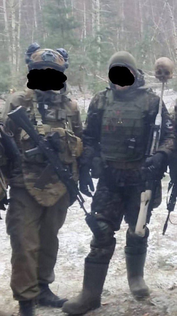 DrewPavlou's tweet photo. Russian soldiers took a photo with the skull of a Ukrainian child impaled on the barrel of a rifle. 

The Russians posted this to Telegram themselves because they were proud of it. 

Unbelievably demonic. https://t.co/OEhzHpaeV3