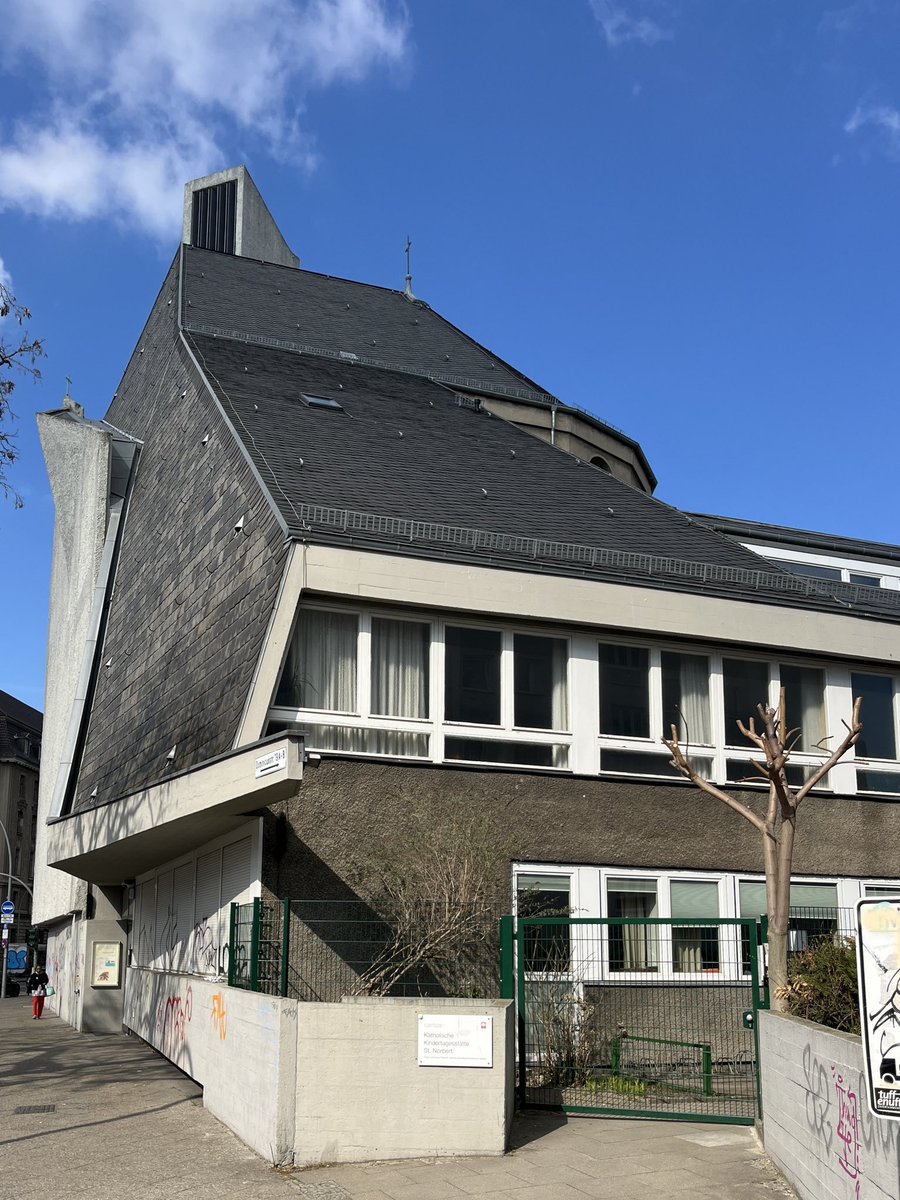 stoneroberts's tweet image. St Norbert Catholic Church, Berlin Schöneberg. Original church 1916, bombed WWll. Preserved and incorporated into new church Fehling & Gogel architects 1958-62. Interior is modified remnant wrapped in a new tower, sculptural wall and ancillary block.