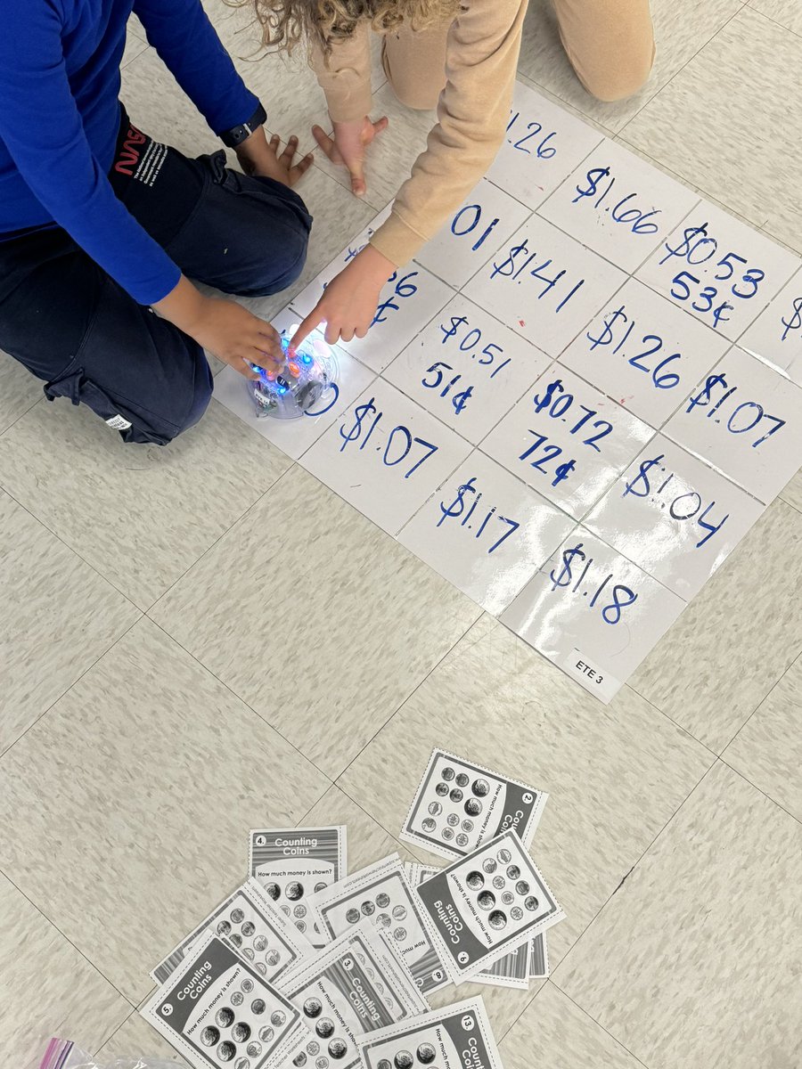 Using blue bots to review counting money amounts using dollars &amp; coins. This might be their favorite math center so far this year!!