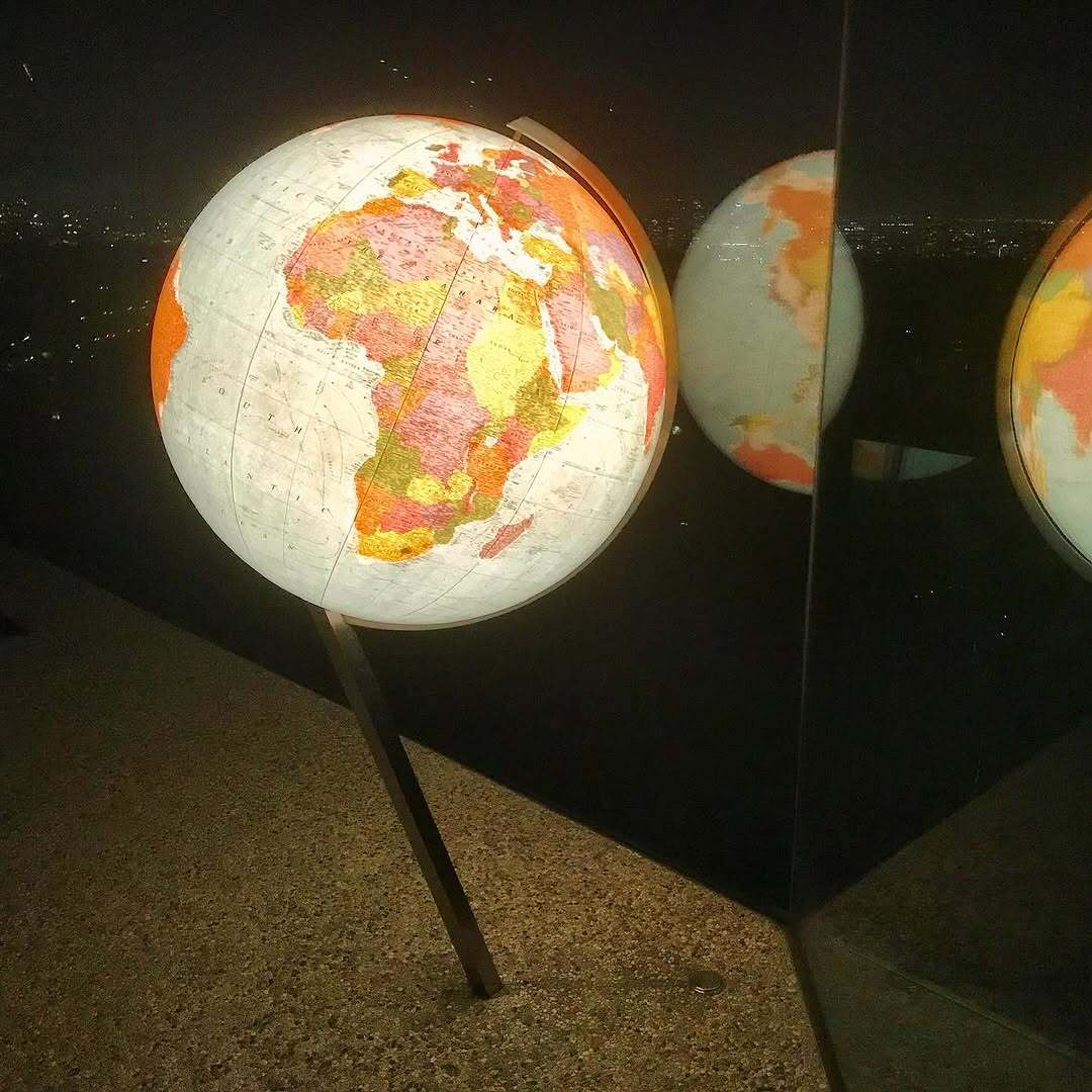 🌍 Check out my giant globe on its fancy stainless steel stand - ready to plan some epic adventures!