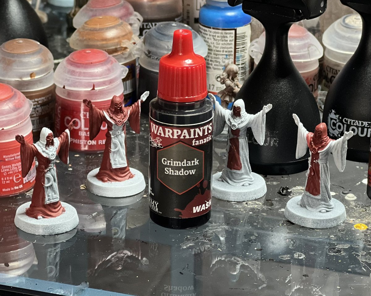 Worship the Grimdark Shadow wash from Army Painter!  This stuff is fantastic.