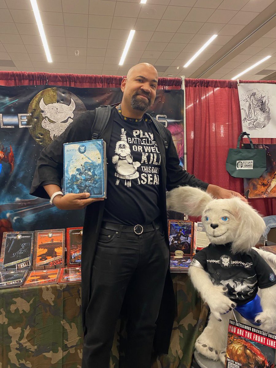 Battlelords of the 23rd Century - Gary Con 2025 (@battlelordsrpg) on Twitter photo The one, the only, <a href="/bdavewalters/">Non-Ironically T.V.'s B. Dave Walters - EVERYWHERE</a> stopped by our booth today to pose with our “bullet tested” (and sun bleached) core rulebook and Bubba the Fott. BDW does not use his powers for good… he uses them for AWESOME! The one, the only, <a href="/bdavewalters/">Non-Ironically T.V.'s B. Dave Walters - EVERYWHERE</a> stopped by our booth today to pose with our “bullet tested” (and sun bleached) core rulebook and Bubba the Fott. BDW does not use his powers for good… he uses them for AWESOME!