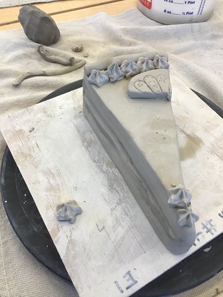 "Seventh-grade Pottery <a href="/AFMSChargers/">Apex Friendship Middle School</a>  are creating cake and pie pieces inspired by Wayne Thiebaud! They are using a variety of tools, media, and processes to add details to their slices. Slip piping was used as an additive feature to enhance their cakes and pies!"