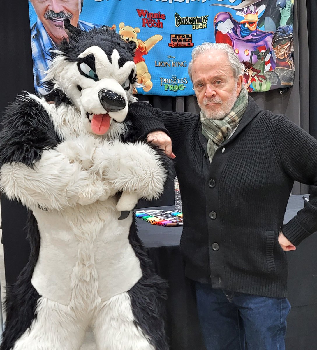FursuitSteele's tweet photo. Couldn't have asked for a cooler comic con! Just got to meet the voice actor for Steele.  The famous Jim Cummings is such a talented and kind person too! #FursuitFriday #KansasComicCon