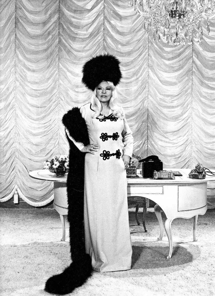 HWDudes100's tweet photo. Some of Mae West's awesome Edith Head costumes for "Myra Breckenridge." Most were in black and white (Mae was fond of wearing white at this stage of her life) with the exception of the gorgeous orange beaded dress she wore for her "You Gotta Taste All the Fruit" number. https://t.co/t9YFwy2cZH