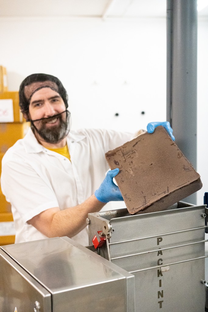 At Moka Origins, cacao nibs are ground in a stone grinder and then the liquid chocolate is poured into bins, where these blocks are formed and allowed to age.