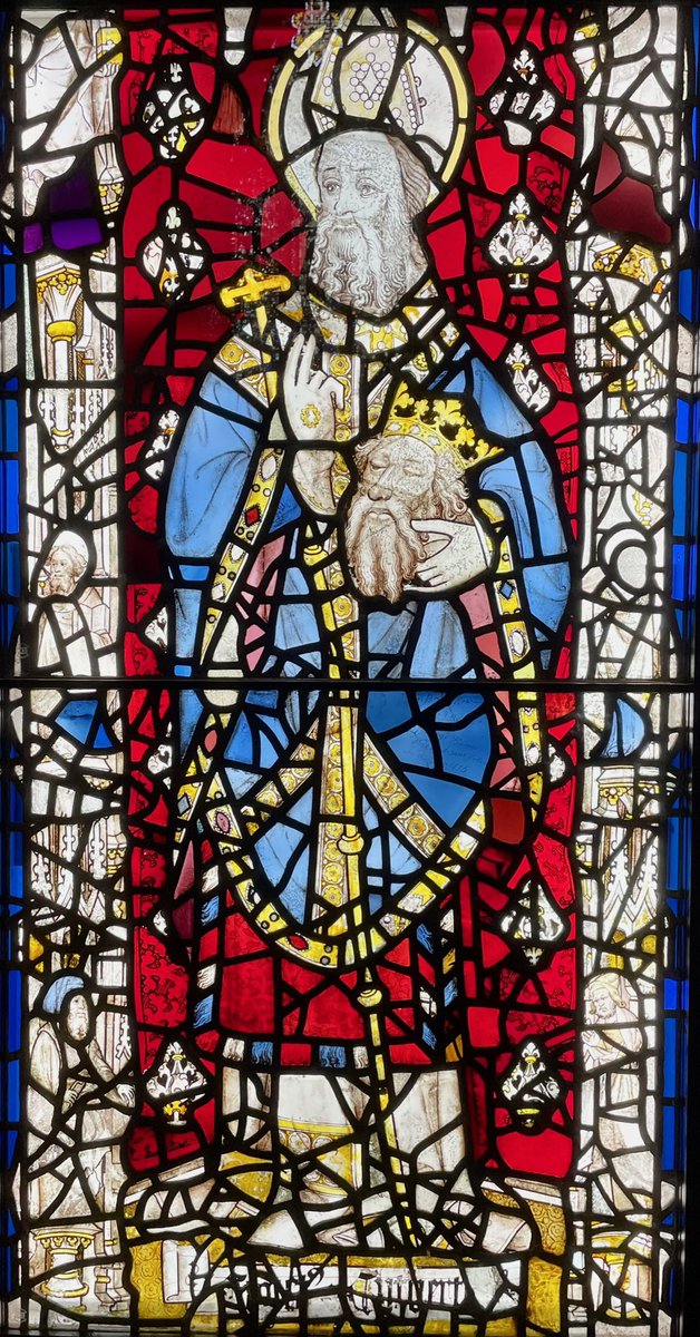 KPW1453's tweet photo. 15th century stained glass depicting St. Cuthbert (with the head of St. Oswald. The panel is part of the St. Cuthbert Window at York Minster which was commissioned by Thomas Langley, Bishop of Durham (1406-37). 📸 My own. #StainedGlassSunday #YorkMinster #Cuthbert https://t.co/mZtCZJyfoI
