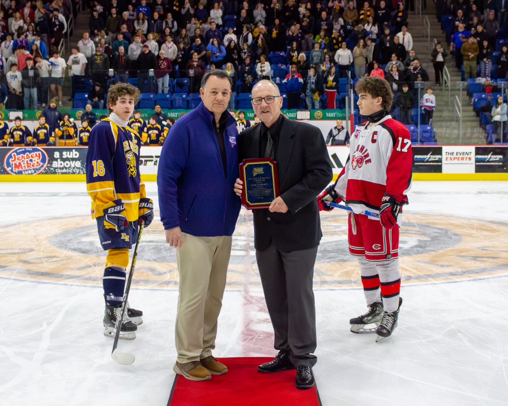 Former longtime Amity Regional High School Head Coach, and winner of two Division II state championships (2008 and 2010), Gary Lindgren took part in a ceremonial puck drop before tonight's Division II State Championship game between Cheshire and the East Haven Co-op.

Lindgren is