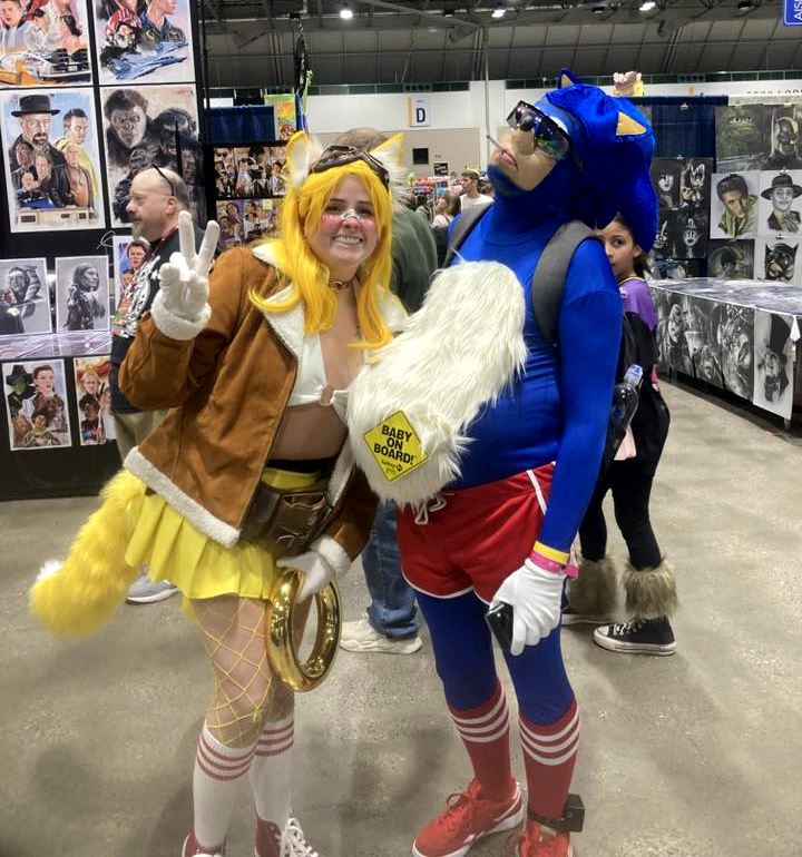 beemop's tweet photo. P.O.O.S. (Preservation of Original/Ugly Sonic) is alive! And a new sub-chapter P.O.O.P.S. (Preservation of Original Pregnant Sonic) is ready to accept new members. ((please do not tell my wife I used AI to change her expression to seem happy in these photos)) #planetcomiccon https://t.co/AIqbUZlQMx