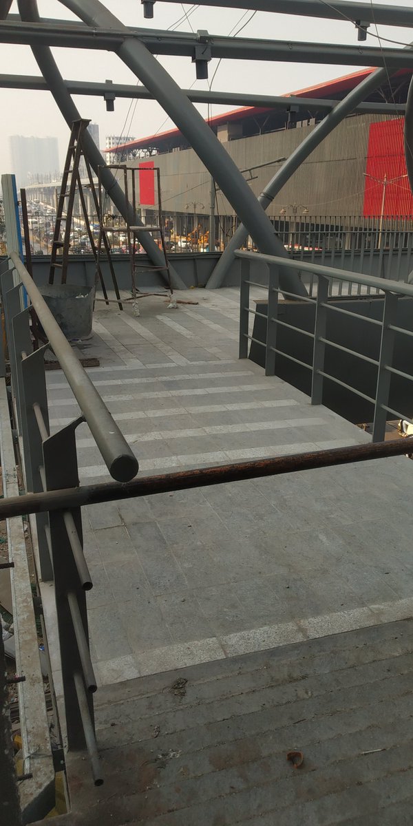 ShaileshBronato's tweet photo. @mybmc @MMRDAOfficial bridge is almost ready, but not opened since many days. Entry is possible, exit is also possible still metro commuters are climbing one bridge - get down and again head of escalator/stairs for #Aarey metro. Pls help. https://t.co/5YUIuSBeJ4