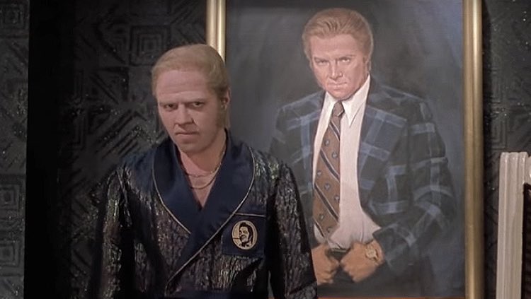 Donald Trump poses with his portrait in the Colorado state Capitol.