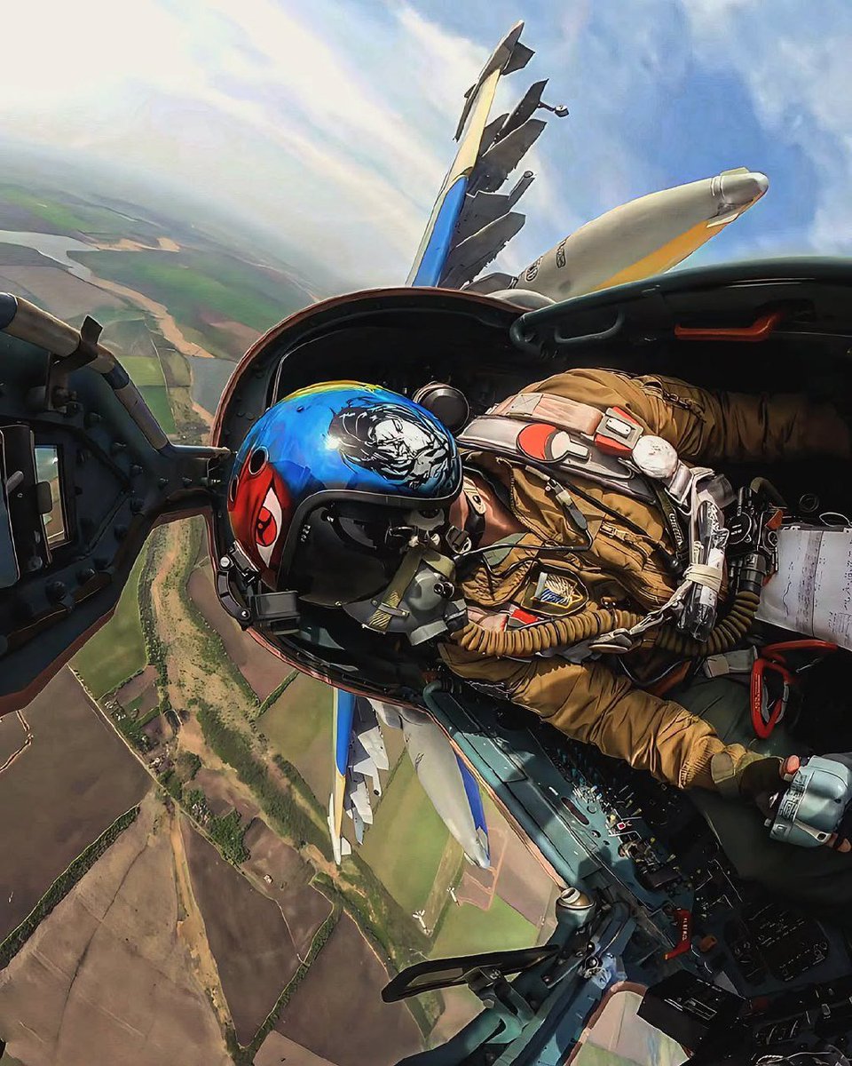 Over eastern Ukraine, a Ukrainian Air Force Su-25 Frogfoot banks away after tossing a pair of French-supplied AASM guided bombs at a Russian target.