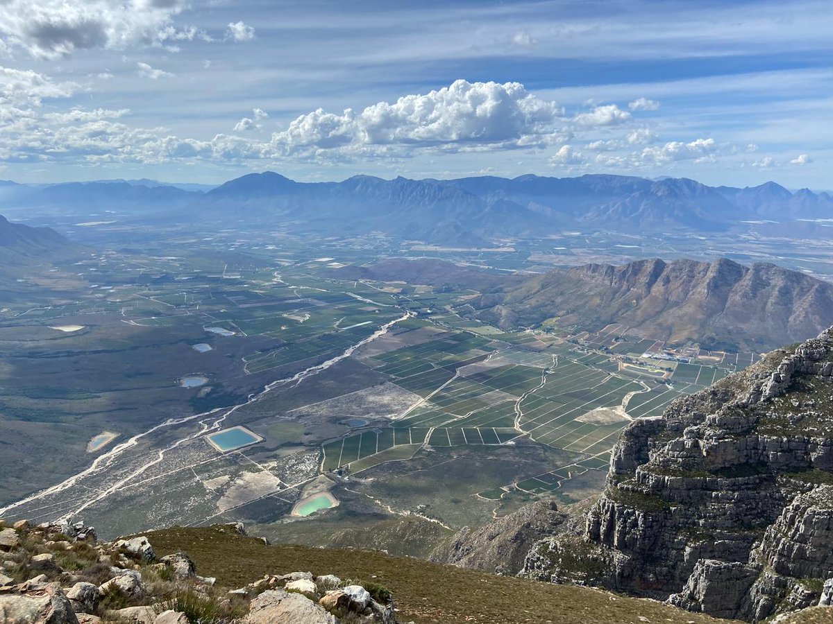 Good morning. Beautiful photo by our local Dominee. It was was taken from the Slanghoek peak. Just in front of the small mountain on the right is where our Cellar is. 
Anyway Blessed Sunday to all.