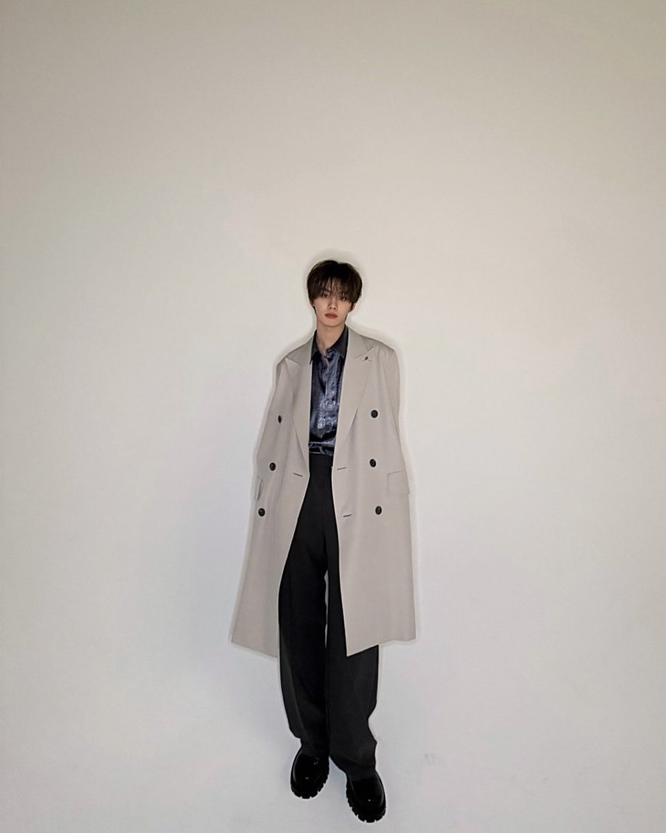 Standing there with my hands in my pockets, coat brushing against my legs and I look straight ahead, knowing that my existence alone bends the silence around me into something real, something that says without words: I'm here, and that's enough.