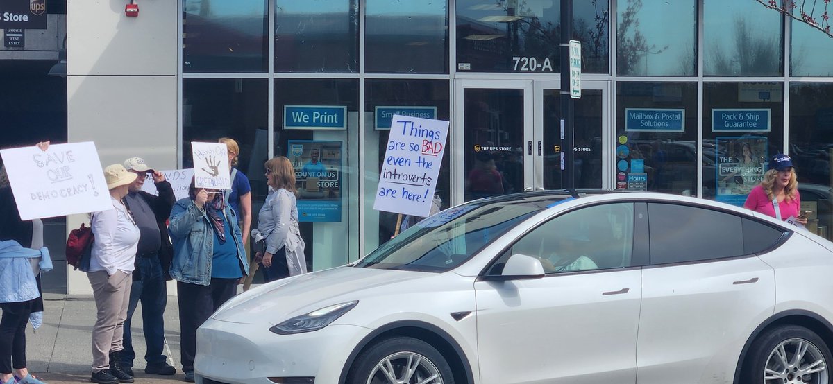 inspiredtoo1's tweet photo. Just a group of those "Radical" terrorist peacefully protesting when a Tesla arrived to force them back on the curb. https://t.co/JLbkPiIuHO