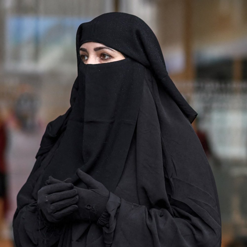 Switzerland fines Muslim woman 100 francs for wearing a burqa in public.