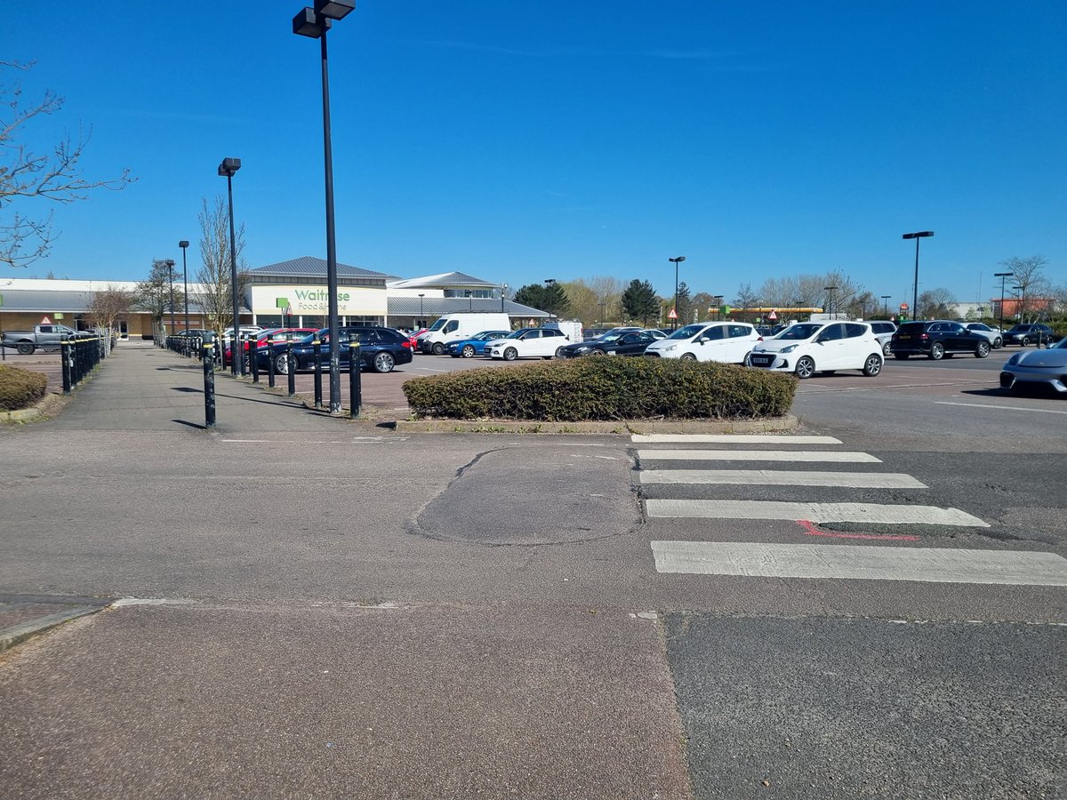 This always baffles me.
The entrance for pedestrians into <a href="/waitrose/">Waitrose & Partners</a> Southend on Sea.
The crossing goes into a kerb and hedge, way off of where the footpath is! 🤔