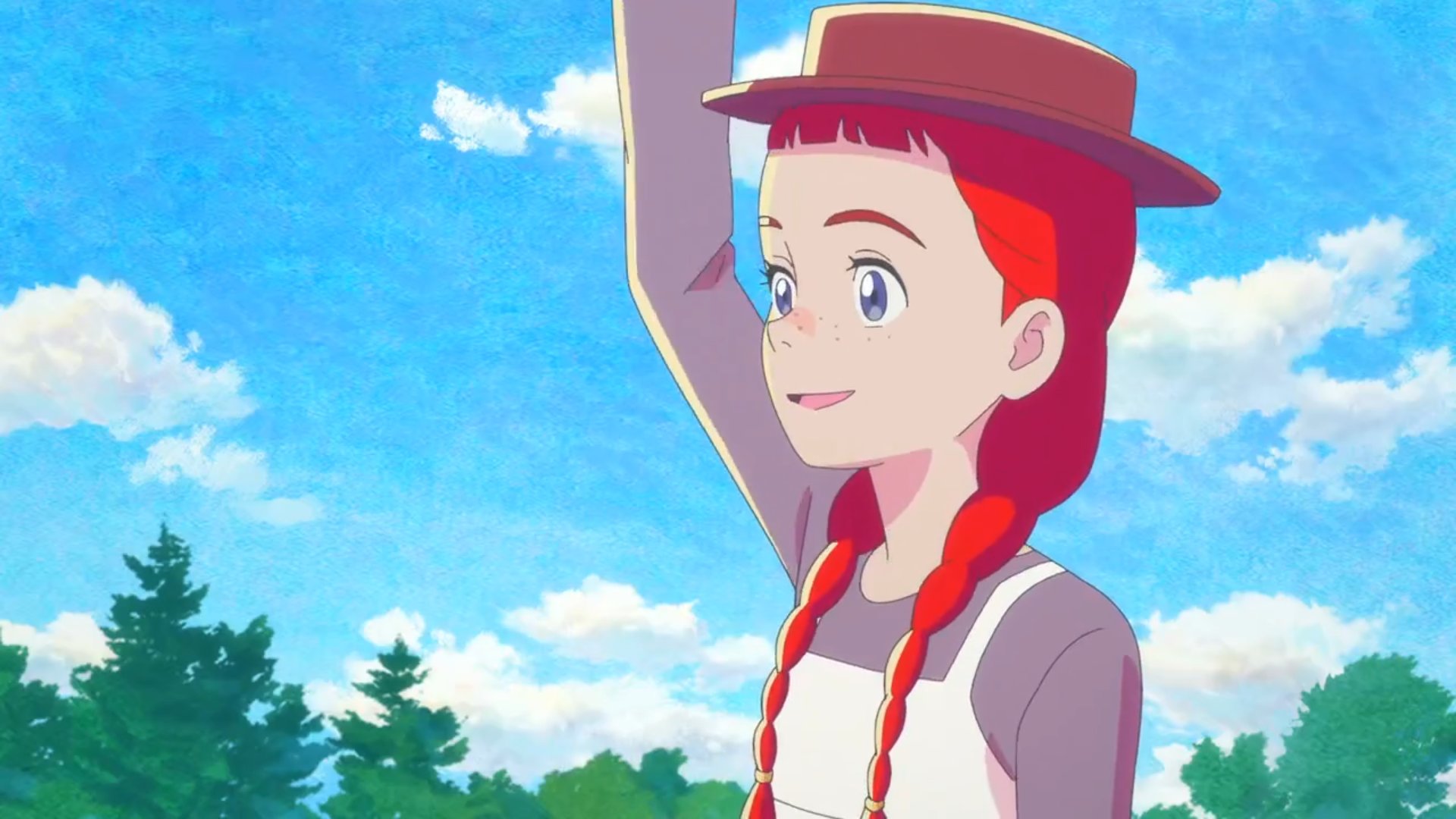Anne Shirley waves to someone under a blue sky with white clouds. 