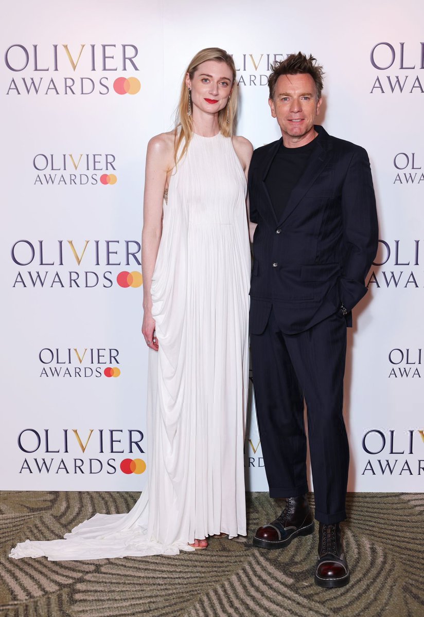 Elizabeth Debicki and Ewan McGregor pose in the Winners Room at The Olivier Awards 2025.
