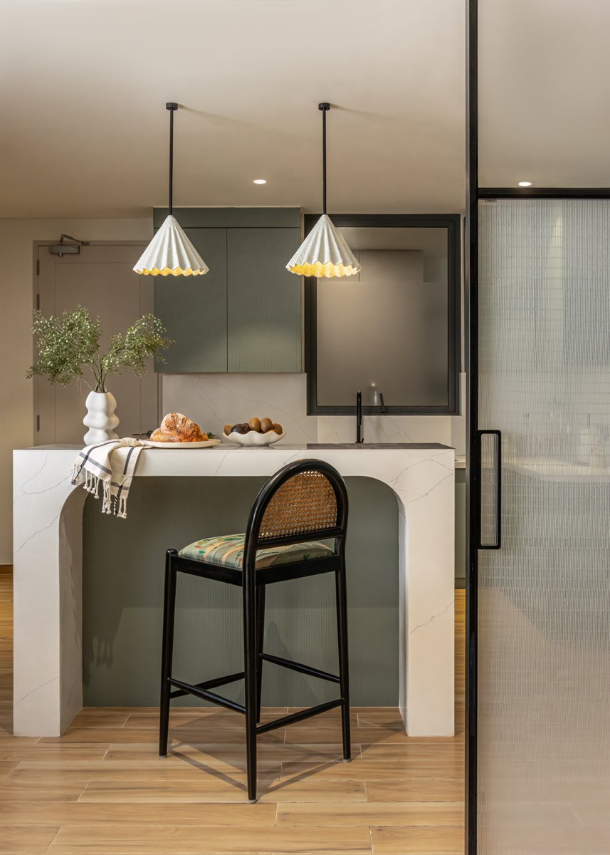 studioipsa's tweet image. Originally enclosed and dimly lit, Kaia’s kitchen now opens into light and warmth.
Pocket doors with fabric glass offer privacy during satsangs without losing elegance.
Muted sage greens, soft curves, and custom lighting bring calm and quiet joy to the space.
#KitchenDetails