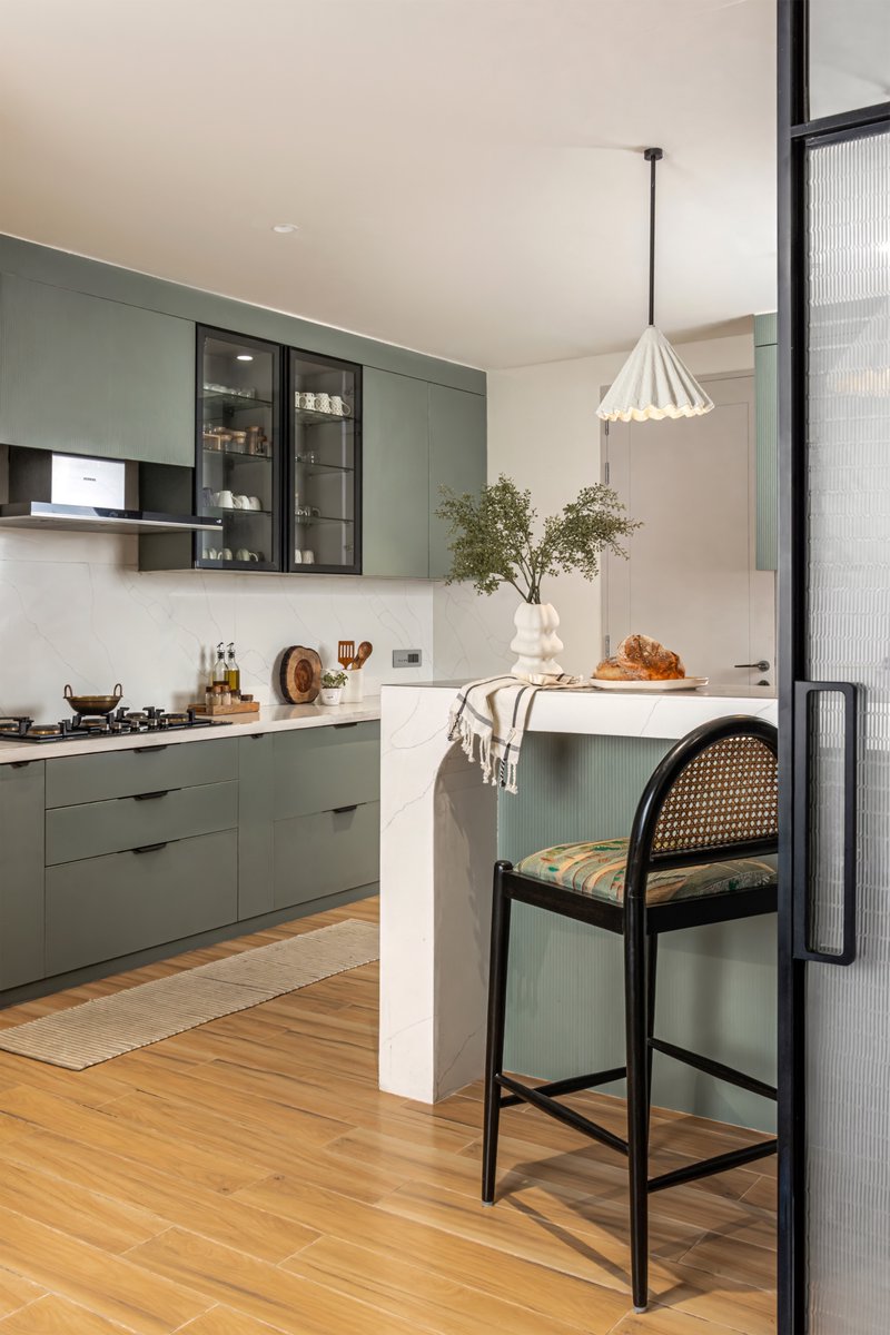 studioipsa's tweet image. Originally enclosed and dimly lit, Kaia’s kitchen now opens into light and warmth.
Pocket doors with fabric glass offer privacy during satsangs without losing elegance.
Muted sage greens, soft curves, and custom lighting bring calm and quiet joy to the space.
#KitchenDetails