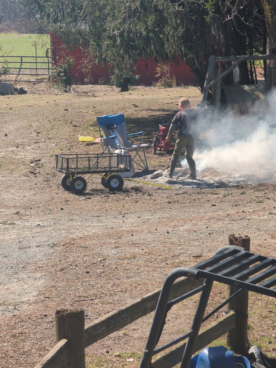 The boy just enjoying a afternoon fire .