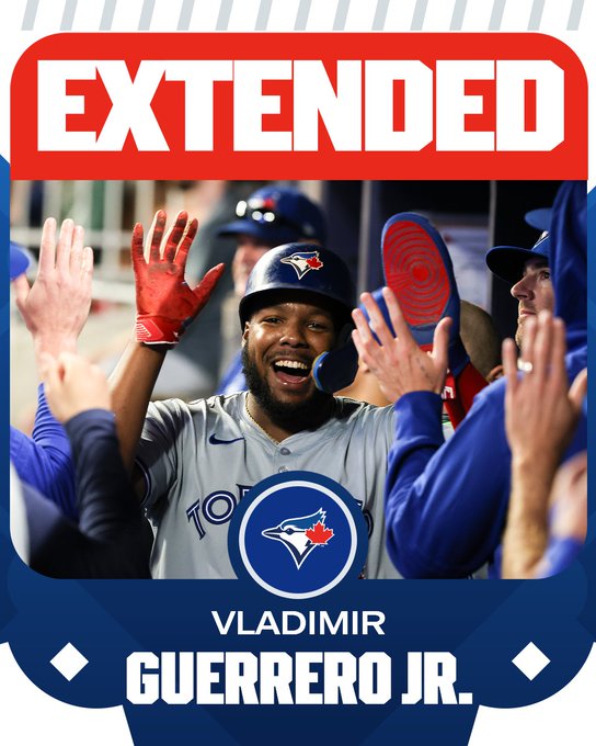 Extended - Vladimir Guerrero Jr. (Toronto Blue Jays)
Pictured: Vladimir Guerrero Jr. smiles while high-fiving teammates as he wears a gray Toronto Blue Jays uniform and blue Toronto Blue Jays helmet.