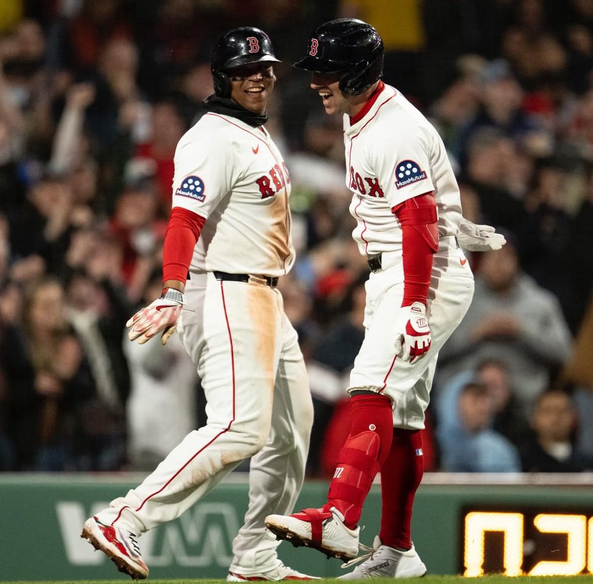 Rafael Devers with Alex Bregman after his first HR with the Red Sox at Fenway.
