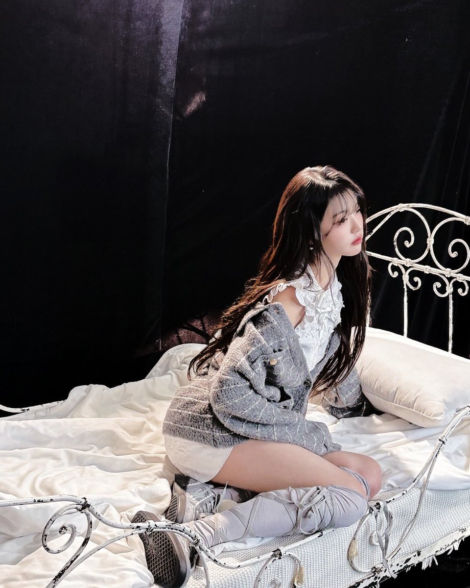 Draped in  the  hush  of  quiet  longing,  like  a
silken  upon a  moonlit garden, she rests upon  
an   iron-framed    bed,   a   vision  of   delicate 
reverie, her  brow  furrowed   with  dreams  as 
fleeting  and ephemeral  as  the morning  mist