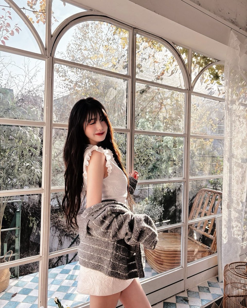 Her  sweater, a  masterpiece of careless grace
slips from   her  frame  as  if   yearning  for  the  
embrace   of   a   gentle   breeze,   woven  with 
silver  threads  that  glisten  like  morning  dew  
upon   a    spider’s    silken   web