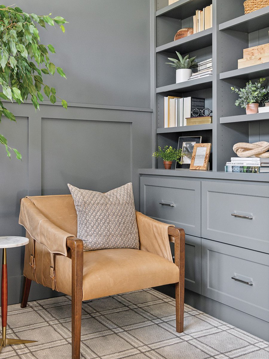 The trend of color-drenching creates a moody, cozy atmosphere in this home office space. Visit whitebearlakemag.com to explore the rest of this Nantucket-inspired Mahtomedi interior design project by Interior Impressions.