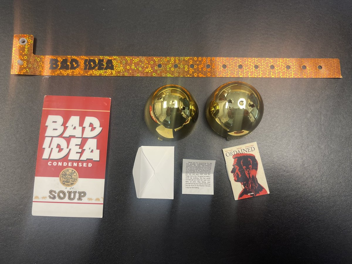 Hey <a href="/badideahello/">BAD IDEA</a>. Just got my “mini” issue of Ordained for the 2nd egg redemption and wristband for this year’s tiki party. Cool stuff! Tell Bobby that his sentiments about the Phantom Menace are fairly accurate. (Yes, I can read micro-print. Business card included for scale.)