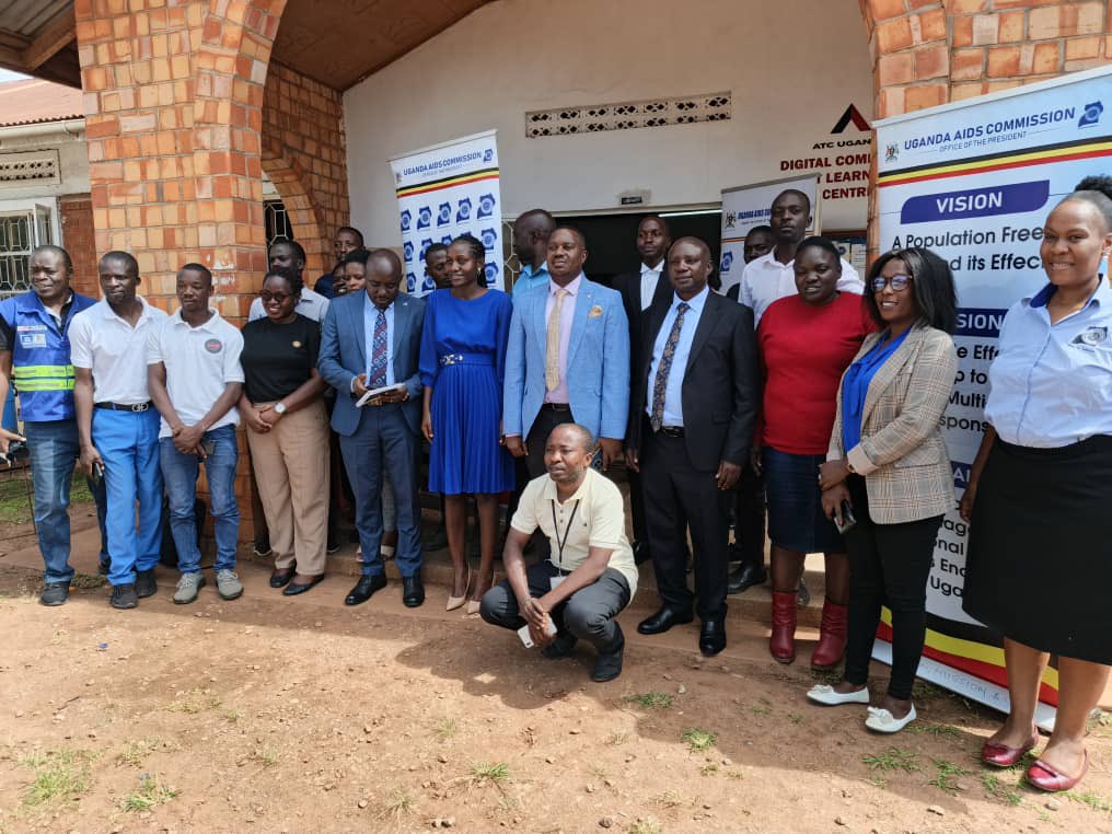 UAC staff and board member pose for a photo with the Hoima City political leaders and the media after the media orientation in Hoima City.

#EndAIDS2030Ug