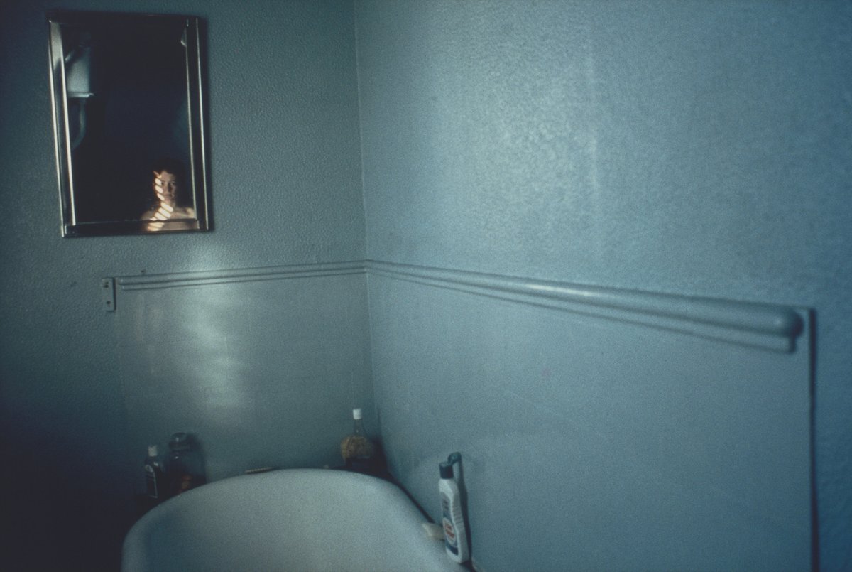 Nan Goldin - Self-Portrait in Blue Bathroom, London, UK, 1980