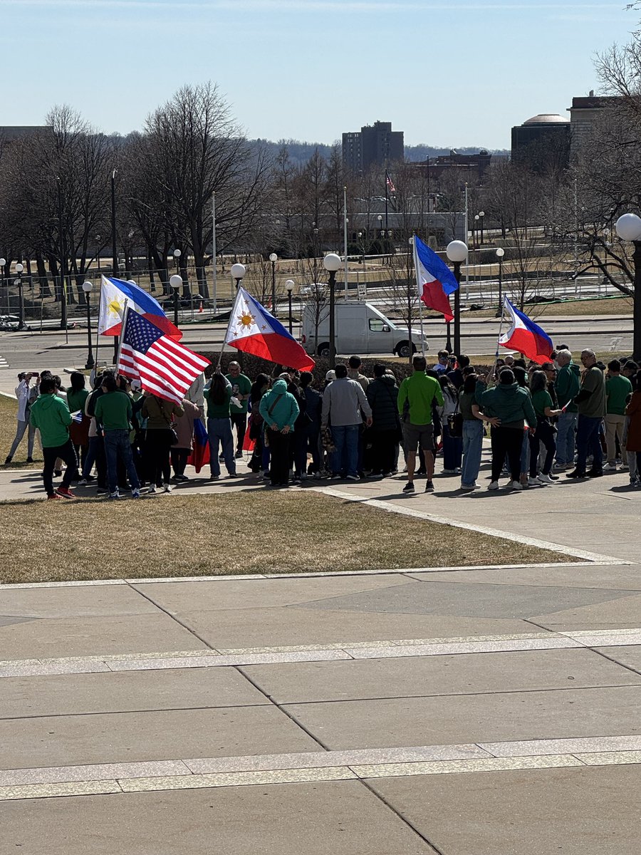 xanderosier's tweet image. In the background of state employee press conference outside MN capitol today: a group supporting Philippines ex-president Rodrigo Duterte, who’s being prosecuted for crimes against humanity in The Hague.