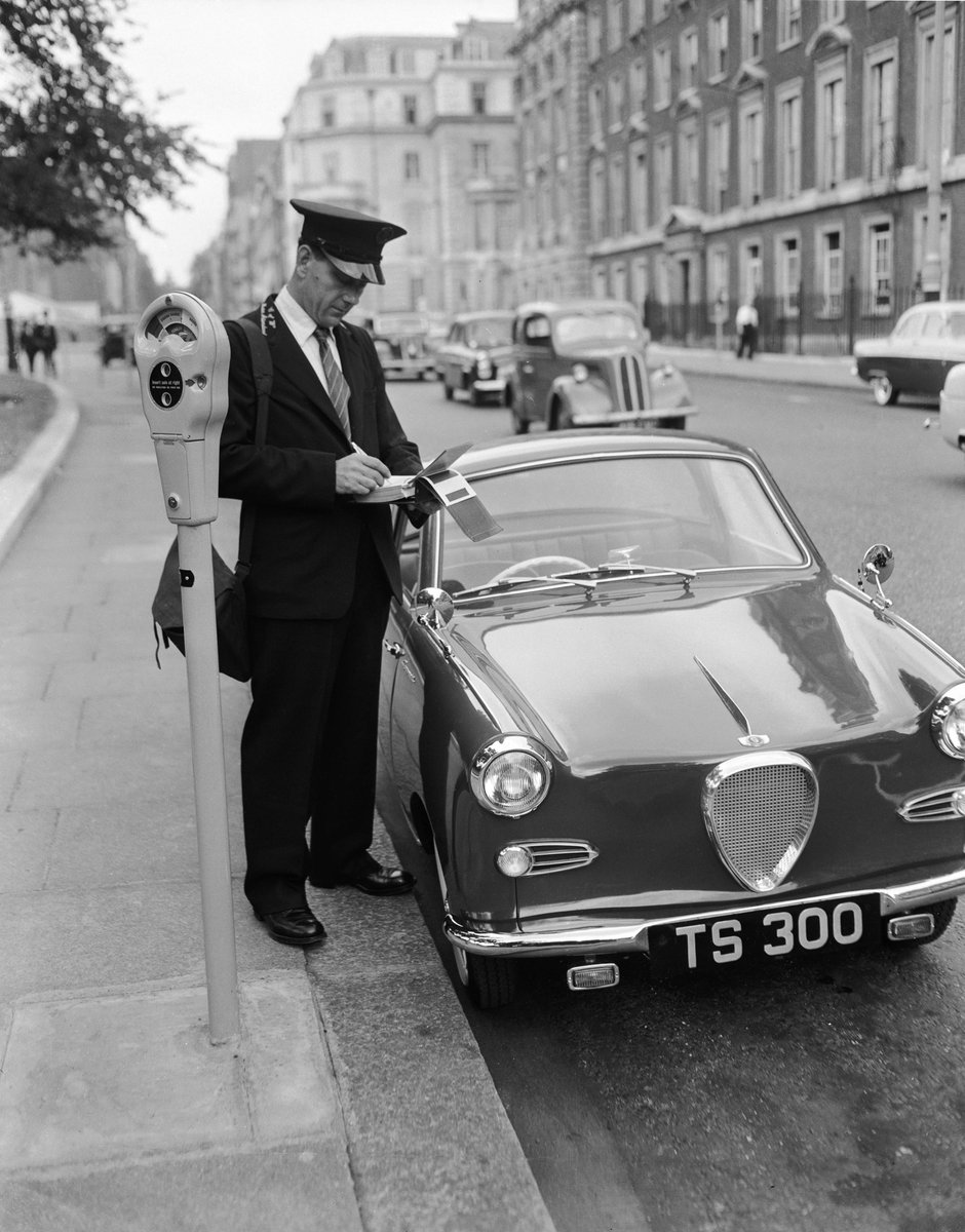 HistoryGirlBW's tweet photo. A traffic warden writes out a parking ticket. Mayfair, London, 1958. https://t.co/2PvuteF2Rz