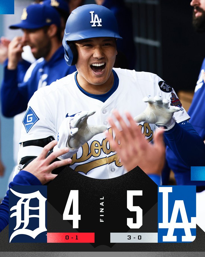 Final: Detroit Tigers 4, Los Angeles Dodgers 5Team records: Tigers 0-1, Dodgers 3-0Pictured: Shohei Ohtani smiles wide as he celebrates a home run in the home dugout Thursday at Dodger Stadium. He wears a white Dodgers home uniform with blue lettering and batting helmet.