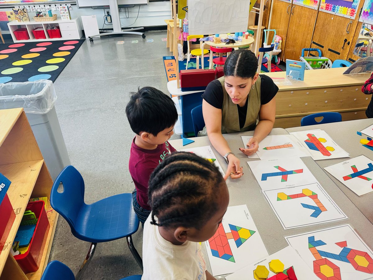 As students in PK3 explored, Ms. Ferdinand asked the following: Do you have a square? What about these pieces? What shape is the blue one? This red trapezoid fits right into here. Can you try to find all the pieces? <a href="/Ps112Q/">PS112Q</a> <a href="/nycdistrict30/">District 30</a> <a href="/Amare112Q/">Yegzeru Amare</a> <a href="/MrWitkes112Q/">Mr. Witkes</a> <a href="/jqychenps112q/">Ms. Chen</a>